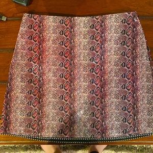 Boutique feaux leather pink and black snake skin skirt.